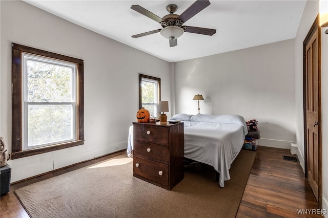 bedroom featuring ceiling fan and dark hardwood / wood-style flooring