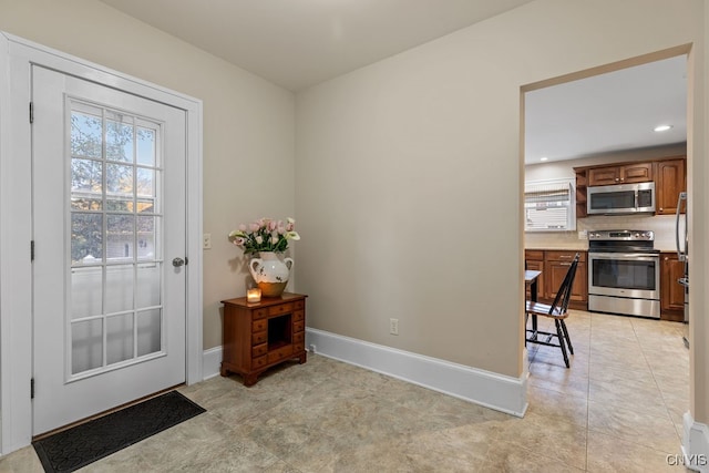 doorway to outside featuring light tile patterned floors