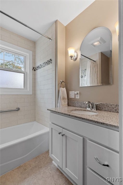 bathroom featuring vanity, shower / tub combo, and tile patterned flooring