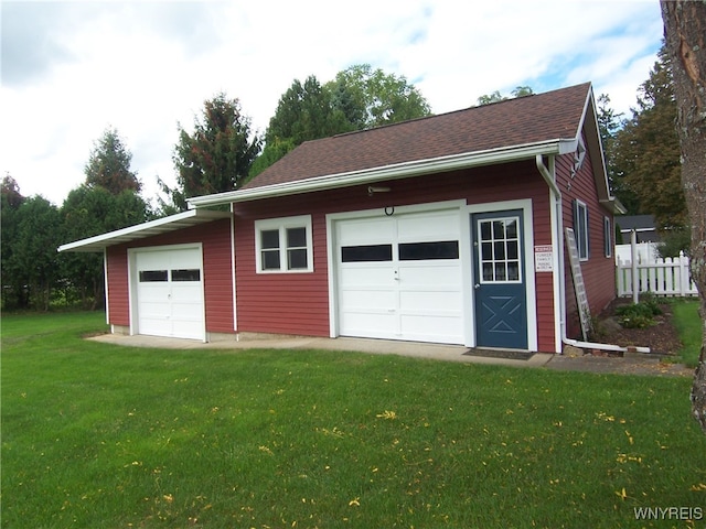 garage with a lawn