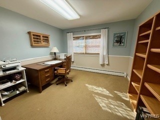 carpeted office with a baseboard heating unit