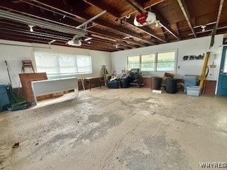 miscellaneous room with a healthy amount of sunlight and concrete flooring