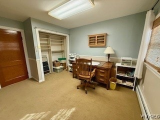 office area with carpet floors and a baseboard heating unit