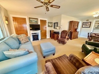 living room with carpet flooring and ceiling fan