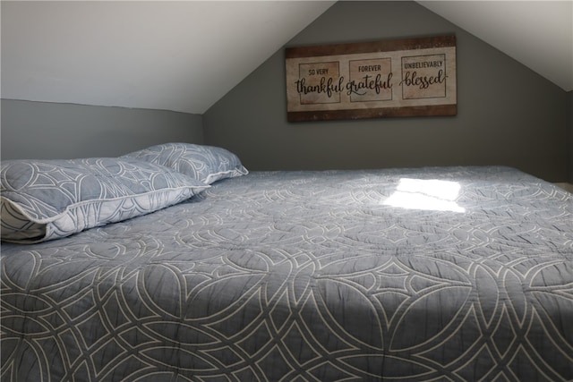 bedroom with vaulted ceiling