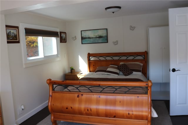 bedroom featuring dark carpet