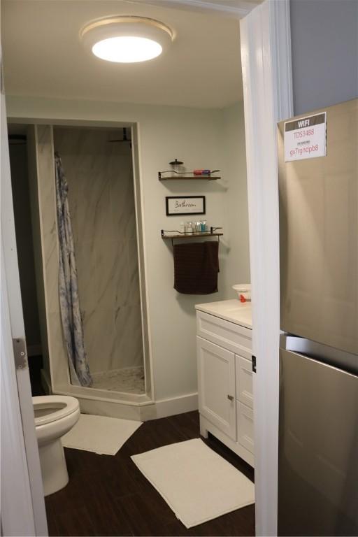 1323 Crystal Lake Rd, Deposit, NY 13783 - full bathroom with a stall shower, vanity, and wood finished floors