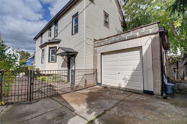 view of side of property with a garage