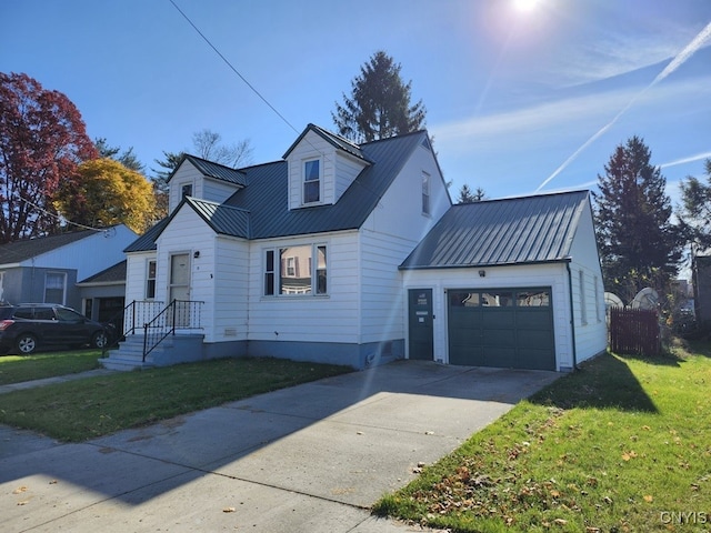 view of front of house with a front yard and a garage