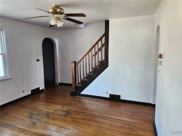 spare room featuring ceiling fan and dark hardwood / wood-style flooring