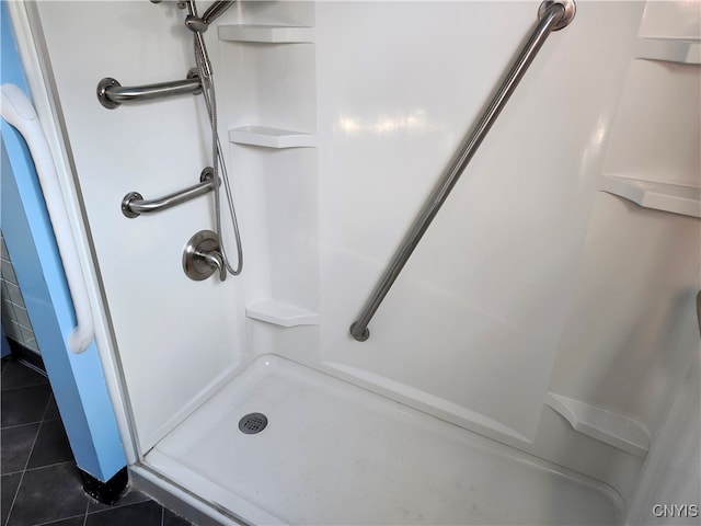 bathroom featuring a shower and tile patterned flooring