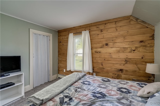 bedroom featuring baseboard heating, crown molding, carpet flooring, and wood walls