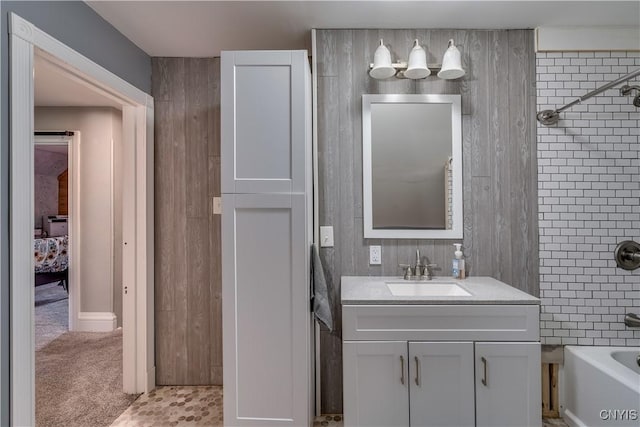 bathroom featuring vanity and bathing tub / shower combination