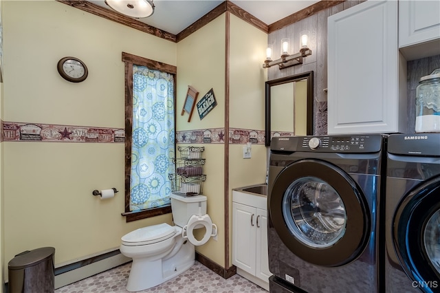 bathroom featuring baseboard heating, independent washer and dryer, and toilet