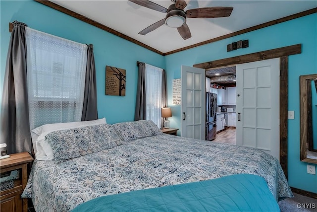 bedroom featuring freestanding refrigerator, a ceiling fan, and ornamental molding