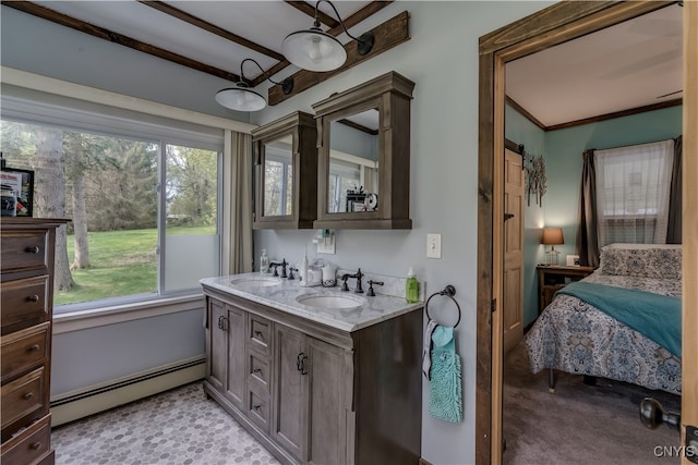 bathroom with vanity, crown molding, and a baseboard radiator