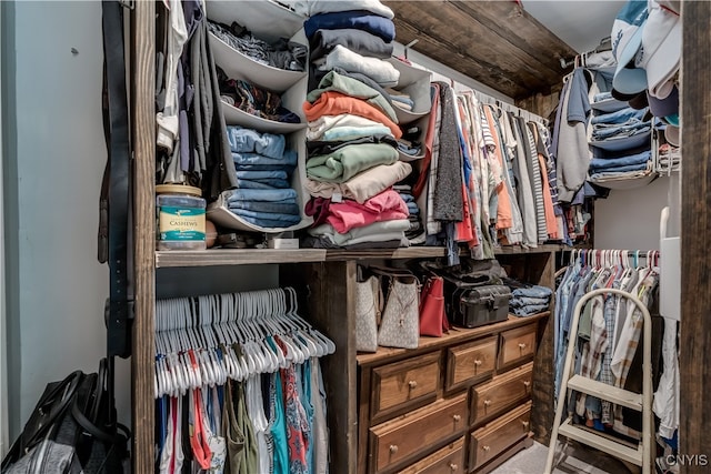 walk in closet featuring carpet floors