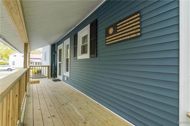 wooden terrace featuring covered porch