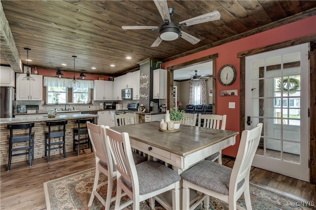 dining area featuring recessed lighting, wooden ceiling, a ceiling fan, and light wood-type flooring