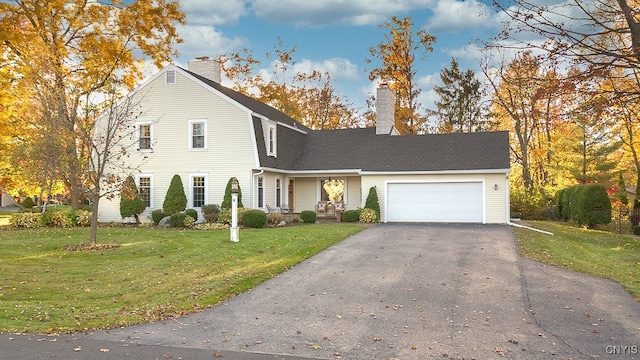 front of property featuring a garage and a front lawn