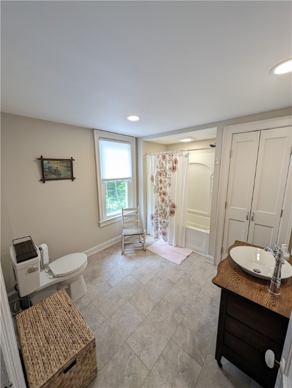 bathroom with vanity, toilet, and walk in shower