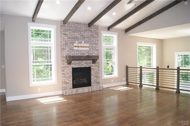 1015 Cold Springs Rd, Salina, NY 13088 - unfurnished living room with lofted ceiling with beams, dark wood-type flooring, and a brick fireplace