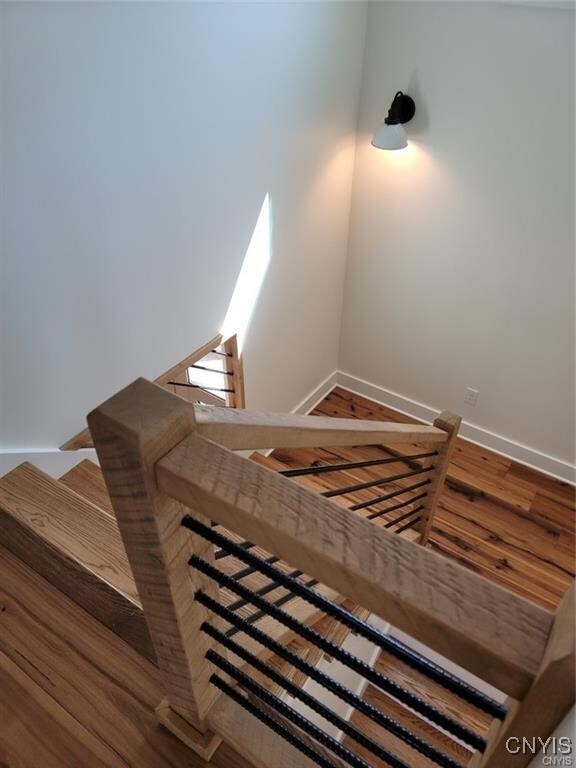 1015 Cold Springs Rd, Salina, NY 13088 - stairs with hardwood / wood-style flooring