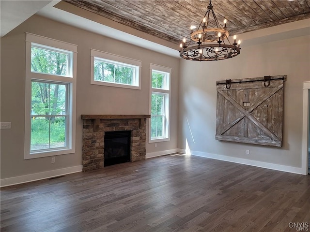 1015 Cold Springs Rd, Salina, NY 13088 - unfurnished living room featuring wood ceiling, a stone fireplace, a chandelier, and dark hardwood / wood-style floors
