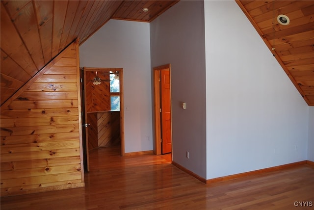 additional living space featuring hardwood / wood-style flooring, wooden ceiling, and lofted ceiling