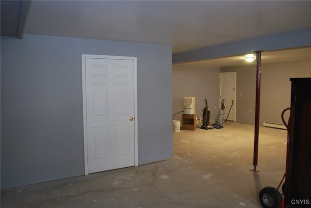 basement featuring a baseboard heating unit