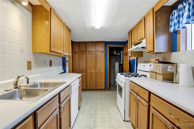 kitchen with white appliances and sink