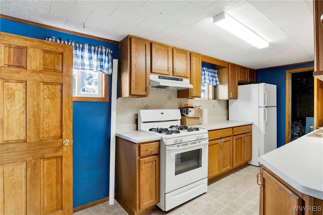 kitchen featuring white appliances, crown molding, and decorative backsplash