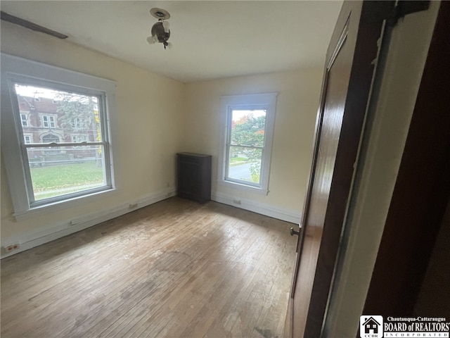 spare room with light wood-type flooring