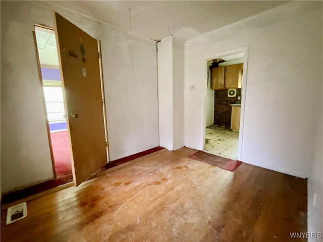 spare room featuring light hardwood / wood-style flooring