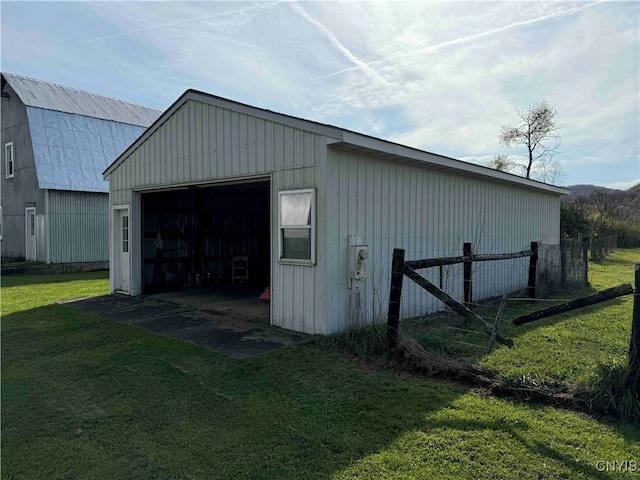 view of outdoor structure with a lawn