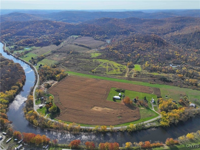 aerial view featuring a water and mountain view