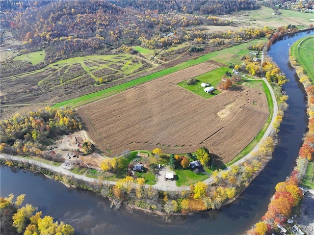 birds eye view of property featuring a rural view and a water view