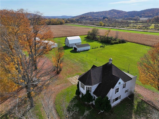 drone / aerial view featuring a mountain view and a rural view