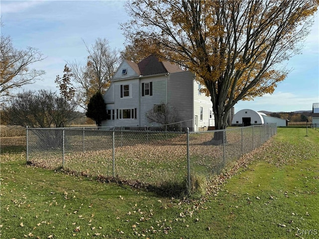 back of house with a yard