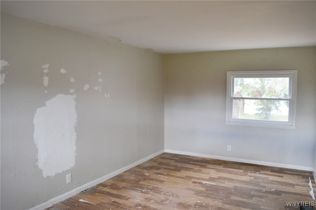 spare room featuring hardwood / wood-style floors