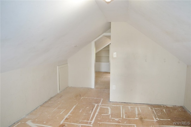 bonus room featuring lofted ceiling