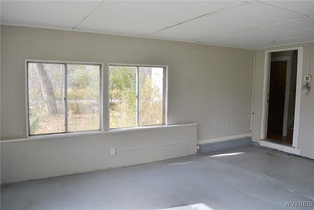 unfurnished room featuring concrete flooring