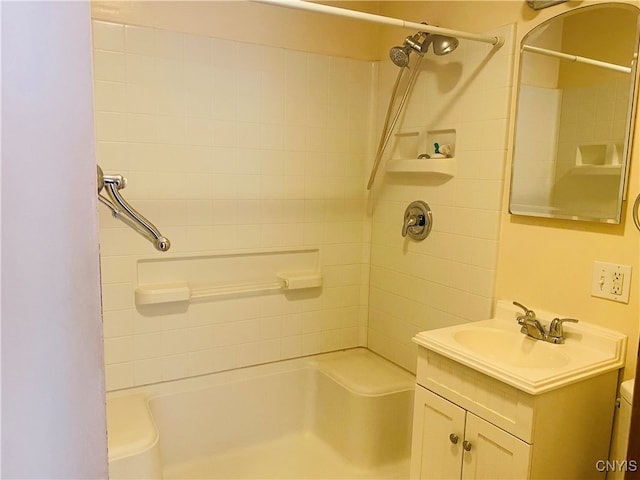 full bathroom featuring vanity, toilet, and tiled shower / bath