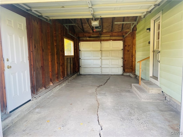 garage featuring wooden walls