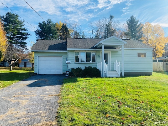 view of front facade featuring a front yard and a garage