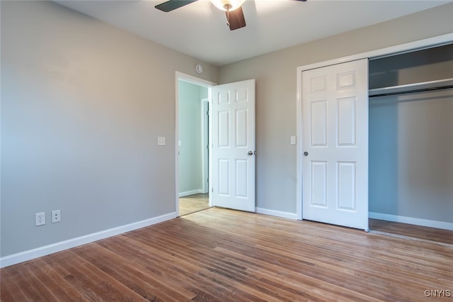 unfurnished bedroom with a closet, ceiling fan, and light wood-type flooring