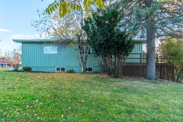 view of home's exterior with a lawn