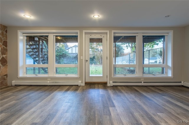 entryway featuring hardwood / wood-style floors and baseboard heating