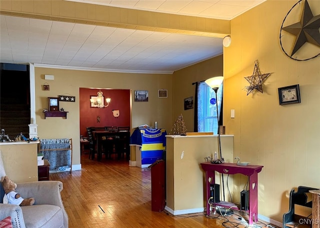 interior space featuring hardwood / wood-style floors and crown molding