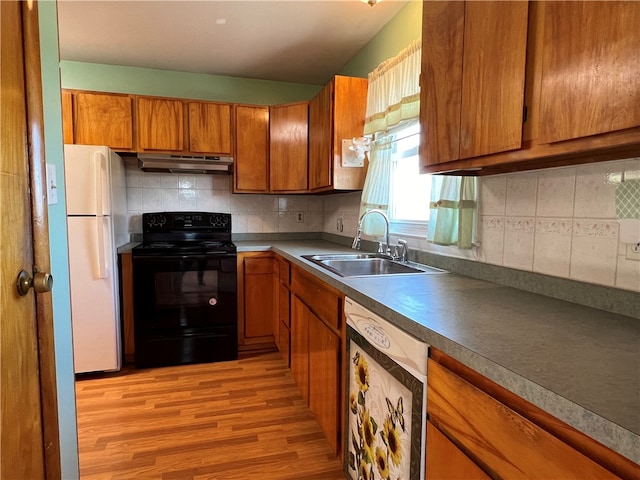 kitchen featuring light hardwood / wood-style flooring, decorative backsplash, sink, and white appliances